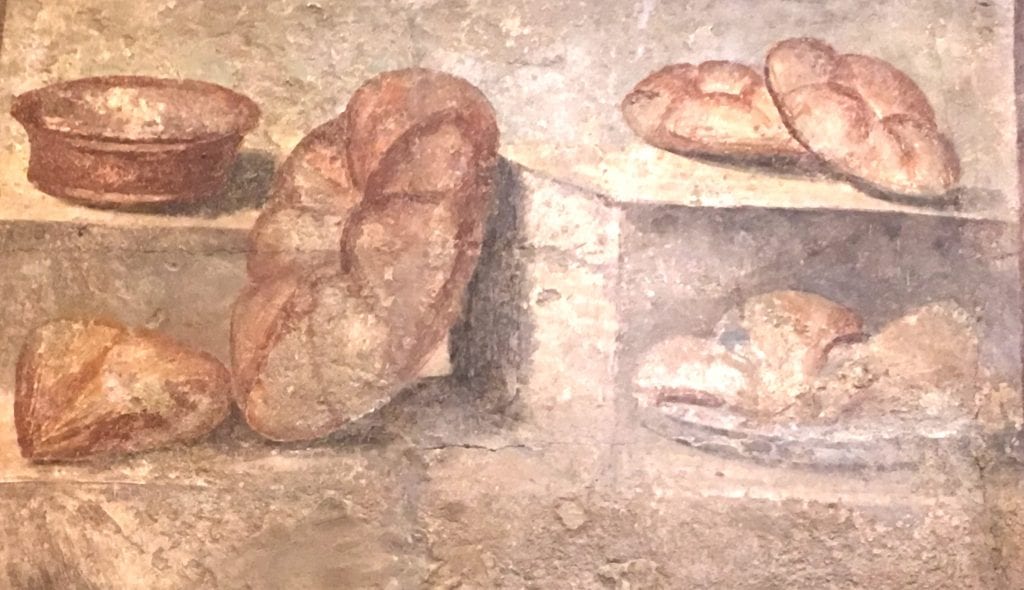 A stamped loaf of bread from Pompeii dated to the first century