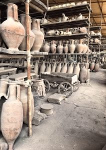 Wine amphorae (Dressel 2-4, lower rows) in the artefacts storeroom at Pompeii