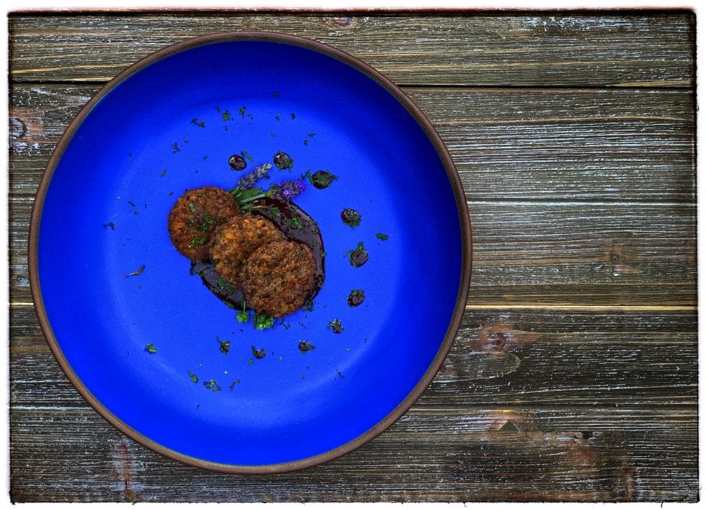 Kneaded Rissole of Spelt and Fava Beans with a Caraway and Red Wine Reduction | Tavola Mediterranea